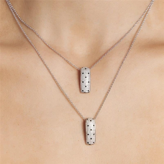 Necklace with rectangular pendant with zirconias pounded to rhodium